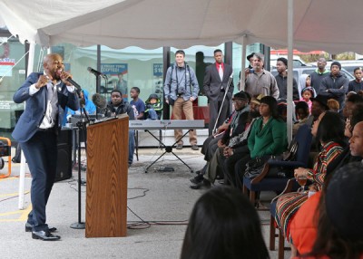 Rev. Carlton Lee gives his church service in a tent on Sunday, Nov. 30, 2014, in Country Club Hills, Mo. His Flood Christian Church burned last week during the riots. (J.B. Forbes/St. Louis Post-Dispatch/TNS)