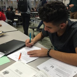 Joey Guliana, a senior student athlete, works on his anatomy homework during the last couple minutes of the period. Guliana and other students are preparing for final exams, which take place Dec. 16-18. Photo by Kevin Sanchez