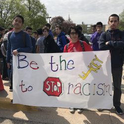 Students stand against racism Friday, April 27. Photo by Isa Gil