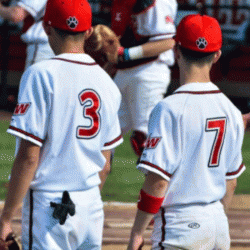 Senior Marvin Maldonado stands on the baseball field, donning his jersey number 3.