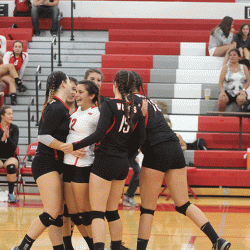 Senior Bianca Tomuta celebrates with her team after a win against Northside College Prep. Photo by Sammy Butera.